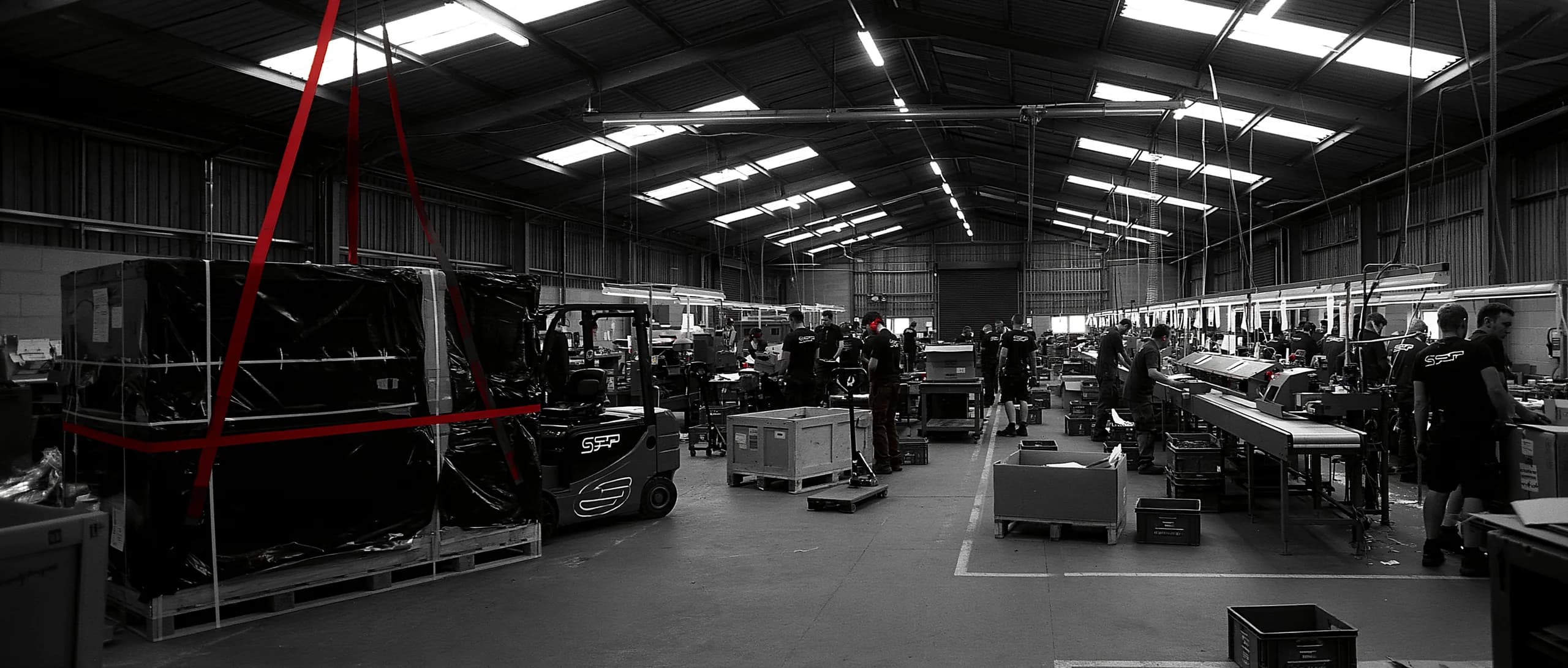 A new production line being installed in a working plant while the existing line runs alongside it